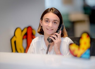 jobs-2 Female Best Buddies Jobs participant answering an office phone